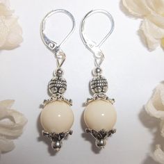 You Will Love The Neutral Color Of This Beaded Earring Set. Brand New & Hand Made By Me - Wvluckygirl. Done With Cream Beige Acrylic Beads And Antiqued Silver Toned Costume Jewelry Beads. The Pair Dangle & Drop From 925 Sterling Silver Lever Backs For Women's Pierced Ears. 1 5/8 Inches Tall & 3/8 Inch Wide. Each Single Earring Weighs 2.0 Grams. Lightweight! Would Make A Fabulous Gift Idea For Her! Fashion Accessory Dangly Dangling Elegant Sophisticated Timeless Classy Classic Piece Everyday Nwt Nickel-free Cream Dangle Jewelry, Elegant Silver Teardrop Beaded Earrings, Nickel-free Elegant Beaded Earrings, White Earrings With Silver Beads For Gift, Elegant Nickel-free Beaded Earrings, White Sterling Silver Earrings With Dangling Beads, Elegant Adjustable Hypoallergenic Beaded Earrings, Elegant Round Beaded Earrings With Silver Beads, Elegant White Earrings With Silver Beads