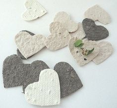 several pieces of felt with hearts and flowers on them are arranged next to each other