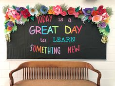 a sign that says today is a great day to learn something new on the wall