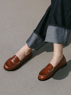 Editor's NotesMOL:pin presents sophisticated footwear that gives off a stylish mood.- Soft and glossy surface loafer- Thick and durable stitch line- Basic and simple loafer design- Soft and durable sheep leather usedMeasurements(in.)- Size: KR 225MM - KR 255MM (US 5.5 - 8.5)- Heel Height: 0.39 in.Composition & Care- Upper: Sheep Leather  Lining: Pig Skin- Natural leather may have fine scratches and wrinkles- Bright leather can get stained by denim or dark outfits- Pen and bond marks may occu Brogue Detail Slip-on Loafers For Work, Classic Flat Slip-ons For Fall, Classic Flat Loafers With Stitched Sole, Classic Brown Platform Loafers For Work, Classic Brown Slip-ons For Fall, Brown Classic Tassel Loafers With Flat Heel, Office Slip-on Moccasins With Stitched Sole, Round Toe Loafers With Stitched Sole For Business Casual, Round Toe Loafers For Business Casual With Stitched Sole