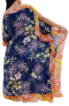 Bright colors and a bold floral pattern distinguish a kaftan that's a comfy and cozy option on warmer days. Boat neck Short sleeves
 100% rayon Hand wash, line dry Imported Model stats: 5'10" height, 32" bust, 25" waist, 36" hip. Flowy Tropical Cover-up With Floral Print, Spring Vacation Kaftan In Viscose, Casual Floral Print Kaftan, Spring Beach Kaftan In Viscose, Spring Beach Viscose Kaftan, Multicolor Rayon Kaftan For Spring, Casual Floral Print Cover-up With Kimono Sleeves, Spring Multicolor Rayon Kaftan, Spring Casual Kaftan With Floral Print