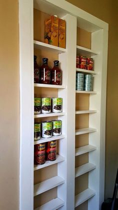 an empty pantry with spices and condiments on the shelves next to each other