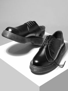 Editor's NotesPASCOROZEN’s derby shoes give a minimal look with a lace-up design and bold, oversized outsole.- Comfortable fit- Lace-up design- Round toe style- Logo engraved in insole- Bold, oversized outsoleMeasurements(in.)- Size: KR250mm(US7) - KR280mm(US10)- Heel Height: 1.6in.- Fits true to the size*Model Info: 5’11’’ KR265mm(US8.5)Composition & Care- (Upper) Synthetic Leather (Lining) Synthetic Fiber (Heel) Synthetic Rubber- Please check the care labelDesigner- by PASCOROZEN Minimal Look, Synthetic Rubber, Sneakers Men Fashion, Derby Shoes, Synthetic Fiber, Synthetic Leather, Shoes Black, Men Fashion, Black Shoes