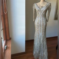 Beautiful Embezzled Mac Duggal Evening Gown. Beads Are Gold, Rose Gold, And Silver. Half Sleeves. Fitted Evening Gown With A Flowy Bottom. Size 4. Worn Once! Silver V-neck Sequin Dress For Wedding, Silver Long Sleeve Evening Dress For Prom, Glamorous Silver V-neck Gown, Embellished Sequin Dress For Wedding Gala, Floor-length Sequin Dress With Sweep Train For Wedding, Sparkling V-neck Evening Dress For Wedding, Wedding Floor-length Sequin Dress With Sweep Train, Floor-length Sequin Wedding Dress With Sweep Train, Floor-length Silver Hand Embellished Dress