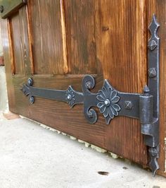 a close up of a door with metal decorations on it's handlebars