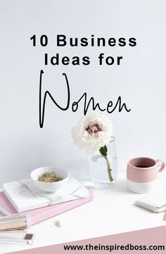 a white table topped with flowers and books