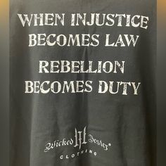 Wicked Jester Black Grafic Tee Shirt. Never Worn. Good Condition. Size Xl Rebellious Cotton T-shirt With Graphic Print, Rebellious Black Crew Neck T-shirt, Black Deadstock Graphic Tee, Rebellious Black Crew Neck Top, Black Graphic Tee From Deadstock, Black Pre-shrunk Grunge Shirt, Edgy Cotton Shirt With Text Print, Black Edgy Shirt With Text Print, Edgy Black Shirt With Text Print
