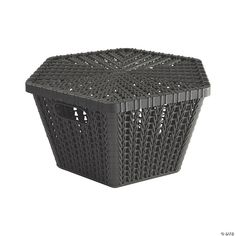 a black plastic basket sitting on top of a white surface with holes in the middle