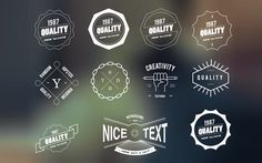 a bunch of logos that are on a glass window with some blurry in the background