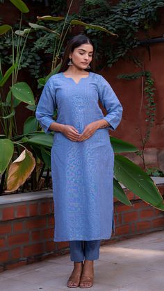 Comfortable kurta made in pure linen fabric with hand embroidered tikkis. Matching straight narrow pants. An absolute all-season essential - cool in summer and warm in winter. Features a round V neck. Quarter sleeves. Fully lined kurta. Kurta Fabric : Linen. Pants Fabric : Cotton Linen. Model height is 5.3” and is wearing a size M. Wash Care : Dry Clean Only. Linen Straight Kurta With Resham Embroidery, Linen Kurta With Resham Embroidery, Straight Linen Kurta With Resham Embroidery, Spring Handloom Chanderi Kurta, Spring Linen Kurta With Chikankari Embroidery, Festive Linen Kurta For Eid, Fitted Linen Straight Kurta Set, Unstitched Linen Kurta For Eid, Festive Unstitched Linen Kurta