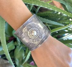 "❋ Handmade Sterling Silver Wide Boho Statement Cuff with Engraved Oxidized Silver Solar Mandala ❋ Dimensions: Width: About 1.5\" (3.8 cm), Length: About 6.9\" / 17.5cm ❋ Metal Purity: 95% Pure Silver (Purer than 925 Sterling Silver) To browse some more of our Silver Jewelry collection you can click on the following links: https://www.etsy.com/shop/SilverShapes Earrings: https://www.etsy.com/shop/SilverShapes?section_id=14809462&ref=shopsection_leftnav_1 Rings: https://www.etsy.com/shop/Silv Bohemian Cuff Bracelet For Weddings, Bohemian Wedding Cuff Bracelet, Bohemian Round Cuff Bracelet For Weddings, Artisan Cuff Bracelet As Festival Gift, Traditional Handmade Jewelry With Wide Band, Handmade Bohemian Round Cuff Bracelet, Bohemian Wide Band Engraved Jewelry, Traditional Handmade Wide Band Jewelry, Artisan Oxidized Bangle Cuff Bracelet