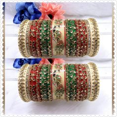 Beautiful Hand Made Traditional Indian Bangles With Kundan Work Hand Work On It. Traditional Hand Work Bangle Chura Set Is Perfect For Wedding Party Wear Or Any Indian Occasion. These Multi-Color Bangles Would Add On In Your Looks. Center Piece Of The Chuda Has Peacock Painting Which Is Making It More Attractive And Making It Real Heavy Rajwari Chuda. Available sizes - 2.4 / 2.6 / 2.8 Why is Chura worn? Popular especially among Punjabi brides-to-be, the wedding Chura signifies the beginning of their wedded life ahead. Although now the Chura has become quite a fashion statement among women, it is traditionally considered to be an important and auspicious Shringar of a newly married bride. Why do Indian brides wear red bangles after marriage? This piece of jewellery signifies good fortune an Festive Multicolor Bridal Sets With Stone Work, Heavy Red Traditional Wear For Festive Occasions, Multicolor Tilla Lehenga For Wedding, Multicolor Wedding Lehenga With Tilla, Traditional Heavy Lehenga For Festivals, Green Stone Work Traditional Wear For Festivals, Traditional Bridal Sets With Gota Work For Festive Season, Traditional Bridal Sets With Gota Work For Festivals, Heavy Multicolor Bridal Sets For Festive Occasions