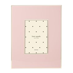 a white and pink frame with polka dots on the bottom, says kate spadee