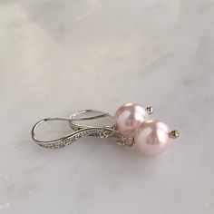 "- Silver, gold or rose gold - Choose your own Swarovski pearl color - 1\" length - .25\" width - Pearl measures 8mm - Comes in signature gift box - Easy returns If you are looking for a simple and classic pair of pearl earrings, these are perfect! The tiny Swarovski crystals in the ear wires offer a subtle shimmer to a timeless pearl drop style. Shop the whole collection: https://www.etsy.com/shop/TigerlillyCouture >> Join our mailing list << http://eepurl.com/cXRBGD" Pearl Drop Bridal Earrings, Drop Bridal Earrings, Pearl Drop Earrings Bridal, Rose Gold Bridal Earrings, Bridal Jewelry Necklace, Pearl Bridal Jewelry, Solid Gold Jewelry, Swarovski Pearls, Rose Earrings