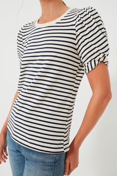 Basic yet fun, the Navy Striped Vesty Puff Short Sleeve Crewneck is the casual cool number you need to update your wardrobe. Featuring slightly puffed sleeves with a knot tie detail and a loose fit, you'll constantly reach for this piece time and time again. From errands to lunch, we are pairing this with our go-to denim and a tote! Crewneck Short puff sleeves Knot detail on sleeves Loose fit Material: 100% Cotton Care: Hand wash, do not bleach, do not iron Navy Short Sleeve Tops With Contrast Stripes, Navy Short Sleeve Top With Contrast Stripes, Striped Cotton Puff Sleeve Top, Classic Navy Short Sleeve T-shirt, Cool Numbers, Blue Short Sleeve T-shirt With Contrast Stripes, Plus And Minus, Navy Stripes, Tie Knots