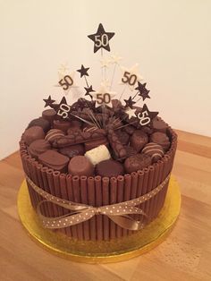 a 50th birthday cake with chocolate and white stars