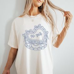 Get ready to say I do in style with our Custom Bride shirt! ️  This shirt is ideal for bridal showers, bachelorette parties, or just showing off your excitement for the upcoming big day! Grab yours today and let the countdown to happily ever after begin! 💕 Comfort Colors Garment Dyed 1717 Unisex T Shirt Relaxed fit, please check the size chart in photos to ensure the correct size.  100% Ring Spun Cotton Pre-Shrunk Fabric for size retention Care Instructions:  Machine wash cold inside out, Tumbl Bridal Tshirts Design, Bride Tshirt Ideas, Bridal Party Tshirts, Blue Coquette, Bow Cake, Bride Tshirt, Cake Custom, Mrs Shirt, Bridal Ideas