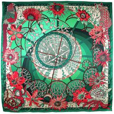 a green square scarf with red flowers on it