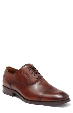 The Florsheim Sorrello Cap Toe Oxford features a modern, tapered toe, and rich burnished finish. Featuring breathable, full leather uppers, breathable suedetec linings, a fully cushioned footbed, and flexible rubber sole. Lace-up vamp Leather upper, rubber sole Imported Timeless Fitted Brown Oxfords, Brown Derby Shoes With Branded Insole And Cap Toe, Fitted Brown Oxfords With Leather Lining, Classic Fitted Oxfords With Leather Footbed, Fitted Brown Dress Shoes, Classic Brown Derby Shoes With Plain Toe, Classic Brown Snip Toe Oxfords, Classic Brown Dress Shoes With Rubber Heel Cap, Classic Brown Cap Toe Dress Shoes