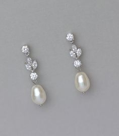 Glamorous White gold Crystal Earrings with a pearl drop will add sweet sparkle to your wedding day. Marquise cz crystals in a leafy design are completed with a Swarovski pearl drop. Customize them and make them you own by choosing a pearl in your custom color from our pearl selection. Silver Earrings Prom, Period Jewelry, Drop Earrings Pearl, Earrings Pearl Drop, Crystal Pearl Earrings, Crystal Earrings Wedding, Pretty Jewelry Necklaces, Crystal Bridal Earrings, Pearl Bridal Jewelry