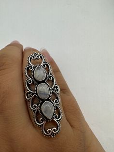 vintage rainbow moonstone ring  St is a silver finished bronze setting  May be marked 925 but is NOT.  This is one of my hand re finished treasures. Salvaged from vintage.  Size  9 Re sizing can be done for a $20 fee and may take up to a week.  Engraving is $4 per letter.  Thank you for supporting a veteran's small business. All jewelry is shipped free within the US in a stylish gift box Vintage Open Moonstone Gemstone Ring, Vintage Moonstone Ring Jewelry, Vintage Moonstone Gemstone Ring, Antique Silver Moonstone Ring, Handmade Vintage Sterling Silver Moonstone Ring, Vintage Handmade Silver Opal Ring, Vintage Silver Handmade Moonstone Ring, Vintage Silver Moonstone Rings, Vintage Handmade Silver Moonstone Ring