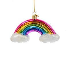 a rainbow ornament hanging from a gold - plated hook on a white background