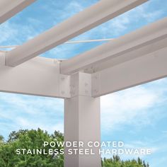 the underside of a white metal structure with trees in the background and text that reads powder coated stainless steel hardware