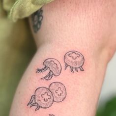 a person with a tattoo on their arm has three different types of vegetables drawn on it