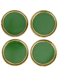 four green buttons with gold trims on them