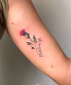 a woman's arm with a flower and the words i am grateful on it