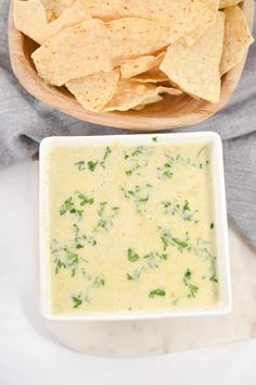 tortilla chips and dip in a white bowl