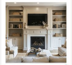 a living room filled with furniture and a flat screen tv mounted above a fire place