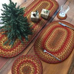 two placemats and a christmas tree on a wooden table