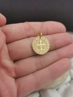 "Personalized 14k Solid Gold Dainty Cross Coin Necklace For Protection, Greek Orthodox Jewelry, ICXC NIKA Coin Pendant, Baptism Gift 0.65 Inch (16.5mm) Diameter pendant 14k Solid Gold ♥ Material of pendant and chain: Solid Gold 14K ♥ Packaging: All of our jewelry is beautifully boxed and ready for gifting For more personalized designs take a look here: ♥ www.etsy.com/listing/631444472 ♥ www.etsy.com/listing/645292671 ♥ www.etsy.com/listing/645282627 ♥ www.etsy.com/listing/631455364 ♥ www.etsy.co Yellow Gold Round Jewelry For Blessing, Gold Round Jewelry For Blessing, 14k Gold Engraved Jewelry For Blessing, Hallmarked Yellow Gold Jewelry For Blessing, Gold Blessing Jewelry, Yellow Gold Round Necklace For Blessing, Gold Cross Jewelry For Blessing Occasion, Dainty 14k Gold Jewelry For Baptism, Engraved Yellow Gold Jewelry For First Communion