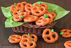 some pretzels are sitting in a basket on a table