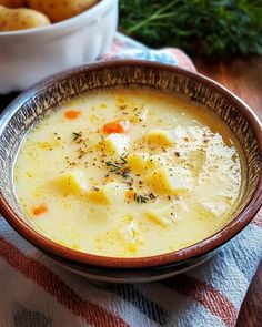 a bowl of potato soup on a table