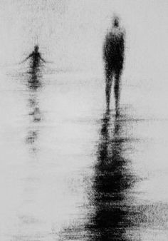 two people are walking on the beach in the foggy water, with one person holding an umbrella