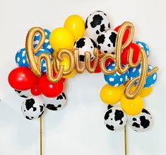 a bunch of balloons that say happy on them