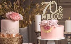 there are three cakes on the table and one is decorated with pink flowers, while the other has gold glitter