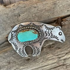 Beautiful Sterling Silver Pin Of The Iconic Bear With A Striking Center Stone Of Royston Turquoise With A Sawtooth Bezel And Highly Detailed, Beautiful Silver Hand Stamping. Marked Sterling And Signed With The Hallmark Of The Artist, Ajc For Navajo Albert Cleveland And His Wife Jeanette, Known For Their Traditional Navajo Jewelry Made With Old Tools From Their Revered Family Of Silversmiths, Making This Jewelry Highly Prized By Collectors. Pin Measures 2 X 1-3/4", Wt 11.75g. The Small Pinback Cl Navajo Jewelry, Old Tools, Royston Turquoise, Silver Pin, The Culture, The Bear, Silver Turquoise, Turquoise Sterling Silver, Blue And Silver