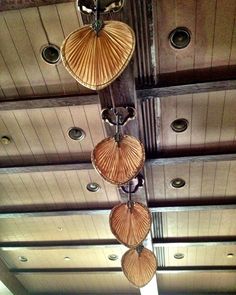 three lamps hanging from the ceiling in a room