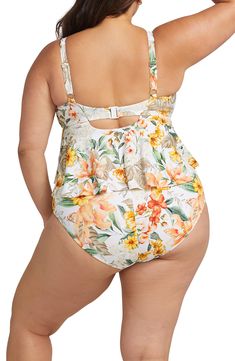 A ruffle front and supportive powermesh lining provide endless comfort in this flouncy one-piece swimsuit as you lounge beside the pool or sea. Removable soft cups   Full back coverage   Removable soft cups   82% recycled nylon, 18% elastane   Hand wash, line dry   Imported One-piece Ruffled Tankini For Poolside, One-piece Ruffled Swim Dress For Pool, Sleeveless Ruffled Swimwear For Sunbathing, White Ruffled Tankini, White Sleeveless Ruffled Tankini, White Ruffled Tankini For Beachwear, Beach Season Swim Dress With Ruffles For Pool, Summer Ruffle Swim Dress For Swimming, Ruffled Swim Dress For Pool