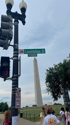 people are walking around the washington monument in washington, d c