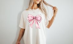 Handmade -This funny Unisex 'Dog Mom' tee is real life and inspirational, it's sure to be a hit! This would be the best gift for a special person in your life! Made with the softest trendy tees we all love! -This shirt is the perfect addition to anyone's wardrobe! Pairs great with leggings, jeans, and shorts as it can be dressed up or down! Its the perfect everyday look that everyone will love! -This updated irresistibly soft unisex tee essentially fits like a well-loved favorite featuring a uni Trendy Crew Neck T-shirt With Bow, Trendy Summer T-shirt With Bow, Casual Summer T-shirt With Pink Bow, Spring Cotton T-shirt With Bow, Casual Short Sleeve T-shirt With Pink Bow, Cute Pink T-shirt With Bow, Cute Bow T-shirt For Spring, Summer T-shirt With Bow And Short Sleeves, Summer Bow T-shirt With Short Sleeves