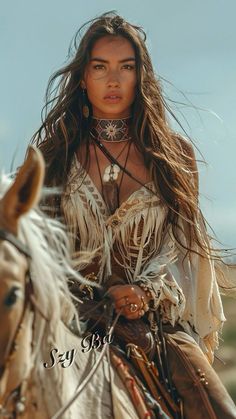 a beautiful young woman riding on the back of a brown horse