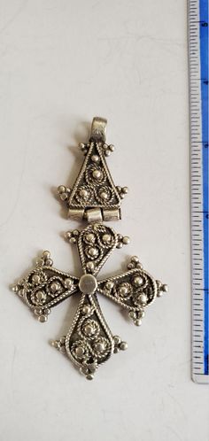 Antique silver cross hinged pendant from Ethiopia. Very nice cross that shows good signs of age. Handmade with filigree detail.. Approx 3.25 inches high and 2 inches across. Old silver (prob 60-80%) Beautiful and distinctive Late 19th - early 20th c. Antique Cross Jewelry With Large Pendant, Traditional Silver Cross Necklace, Ornate Silver Cross Jewelry, Traditional Cross Pendant Large Jewelry, Antique Oxidized Cross Jewelry, Antique Silver Cross Pendant Necklace, Metal Jewelry Making, Silver Cross, Ethiopia