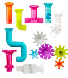 various bath toys are arranged in the shape of pipes and sprinkles on a white background