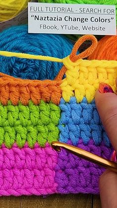 someone is crocheting together with yarn in different colors