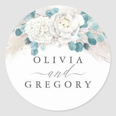 a round sticker with white flowers and leaves on the bottom, reads olivia and grecony