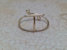 a gold ring sitting on top of a table